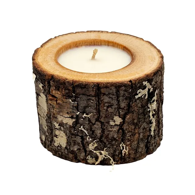 A natural scented candle in an oak wooden vessel with dark bark, custom-made for a furniture shop